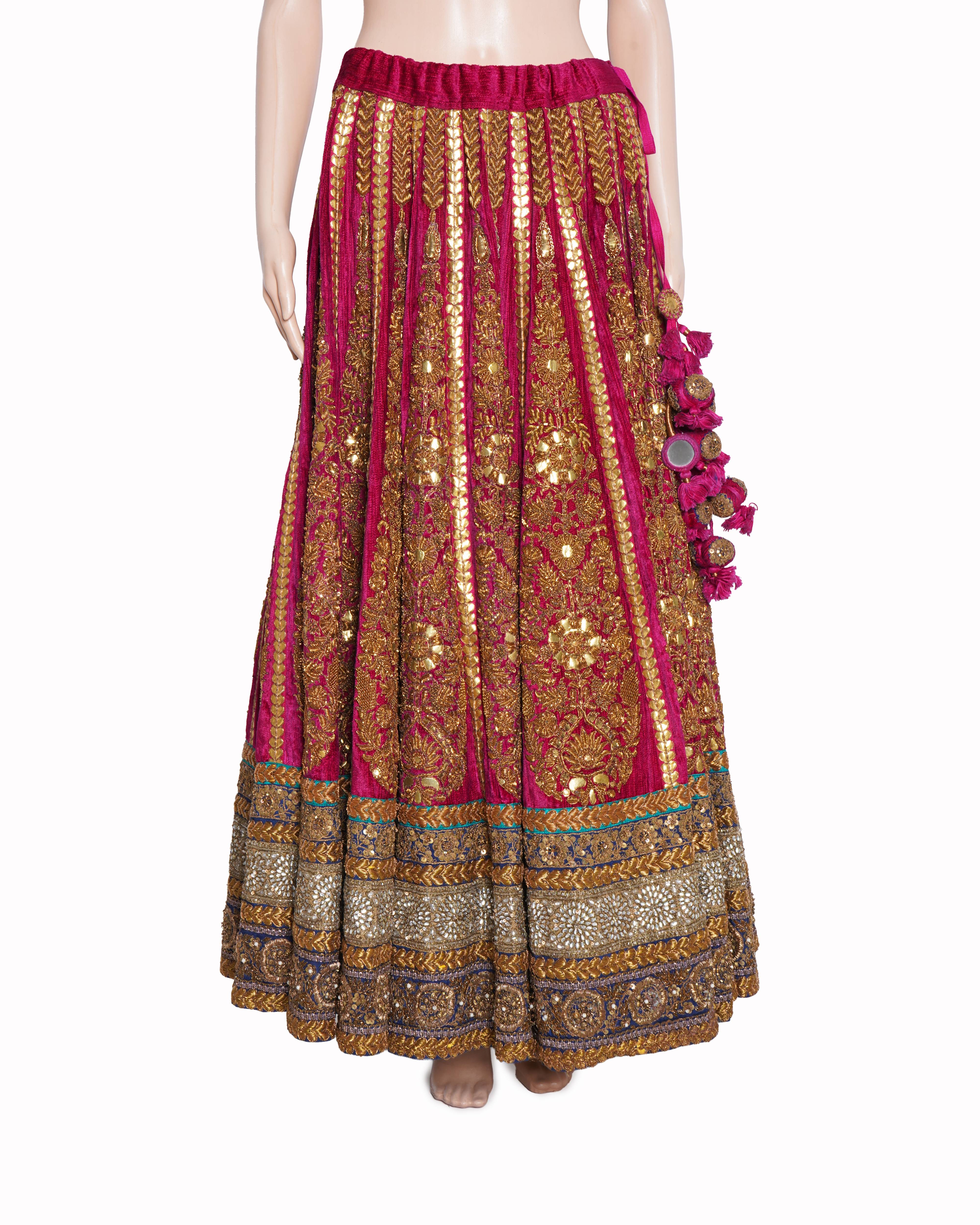 Sabyasachi magenta pink and gold embroidered lehenga