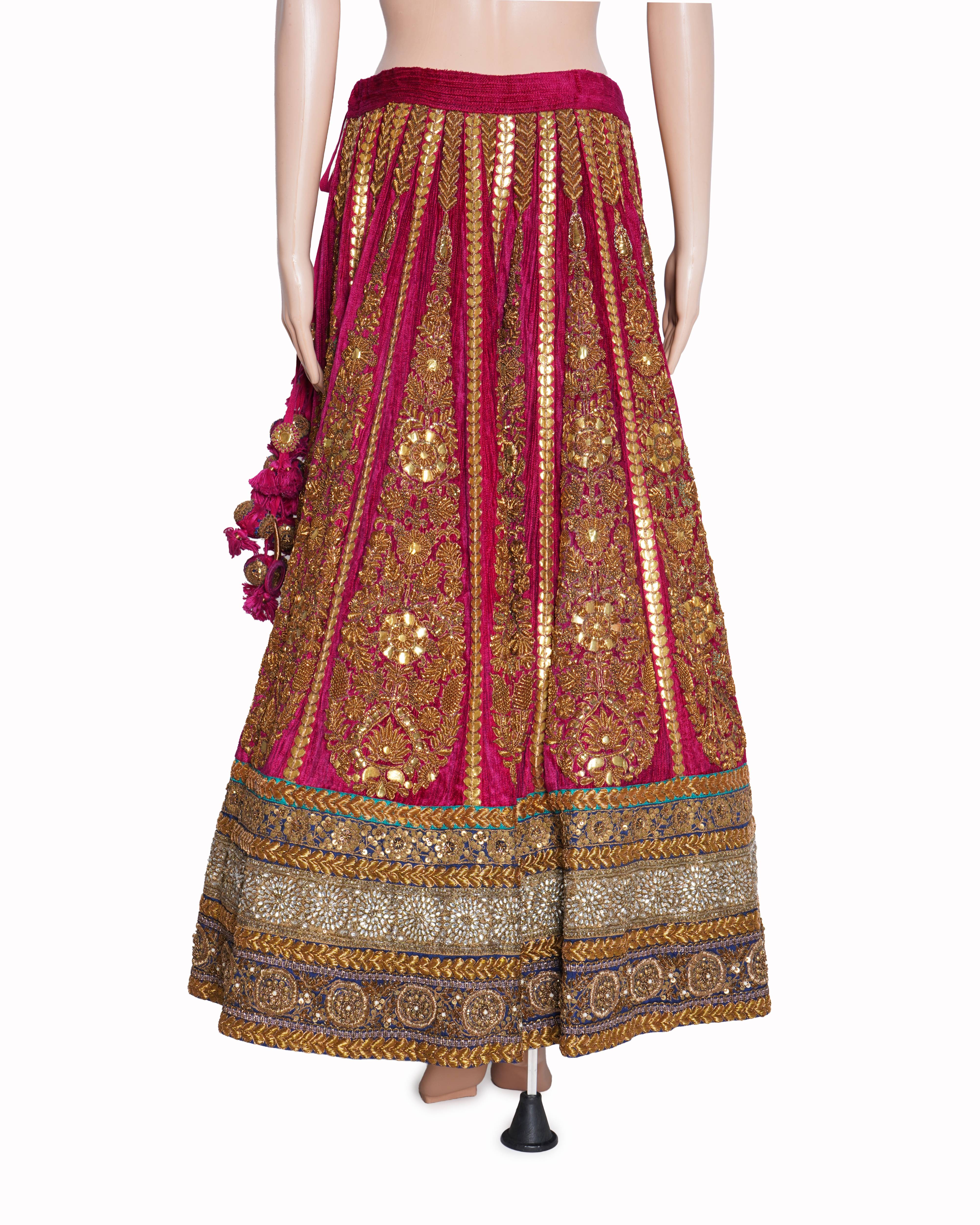 Sabyasachi magenta pink and gold embroidered lehenga