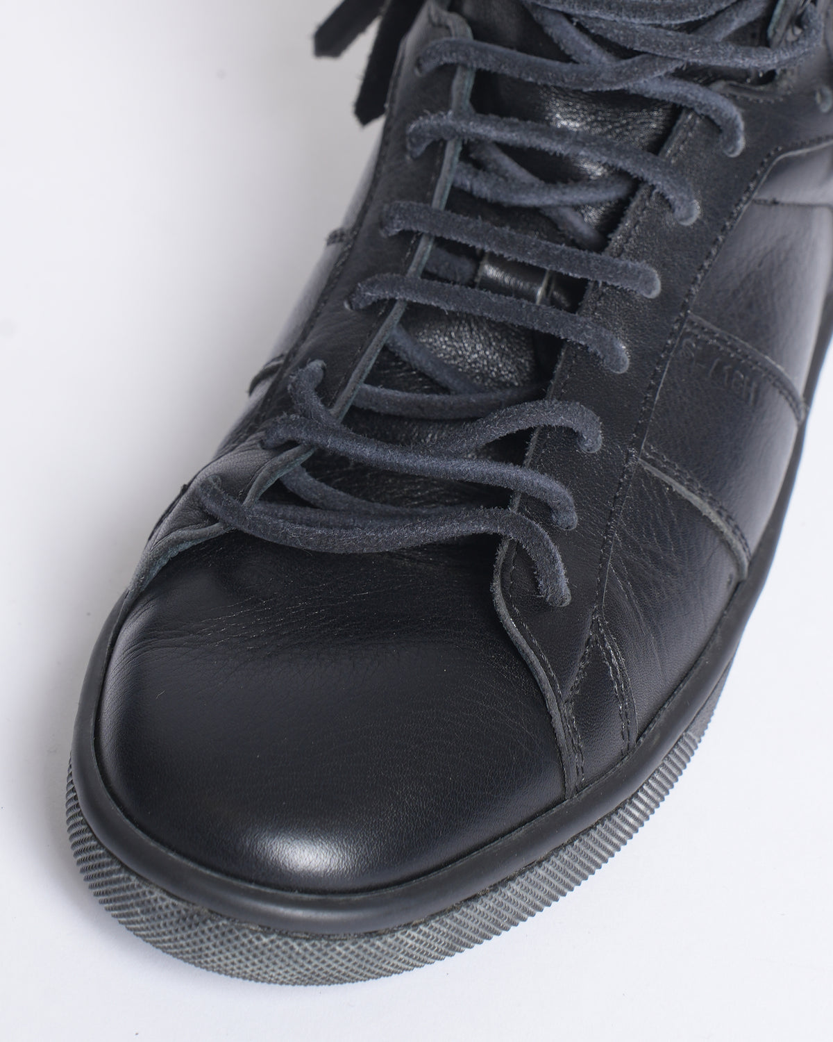 Saint Laurent black fringe leather sneakers