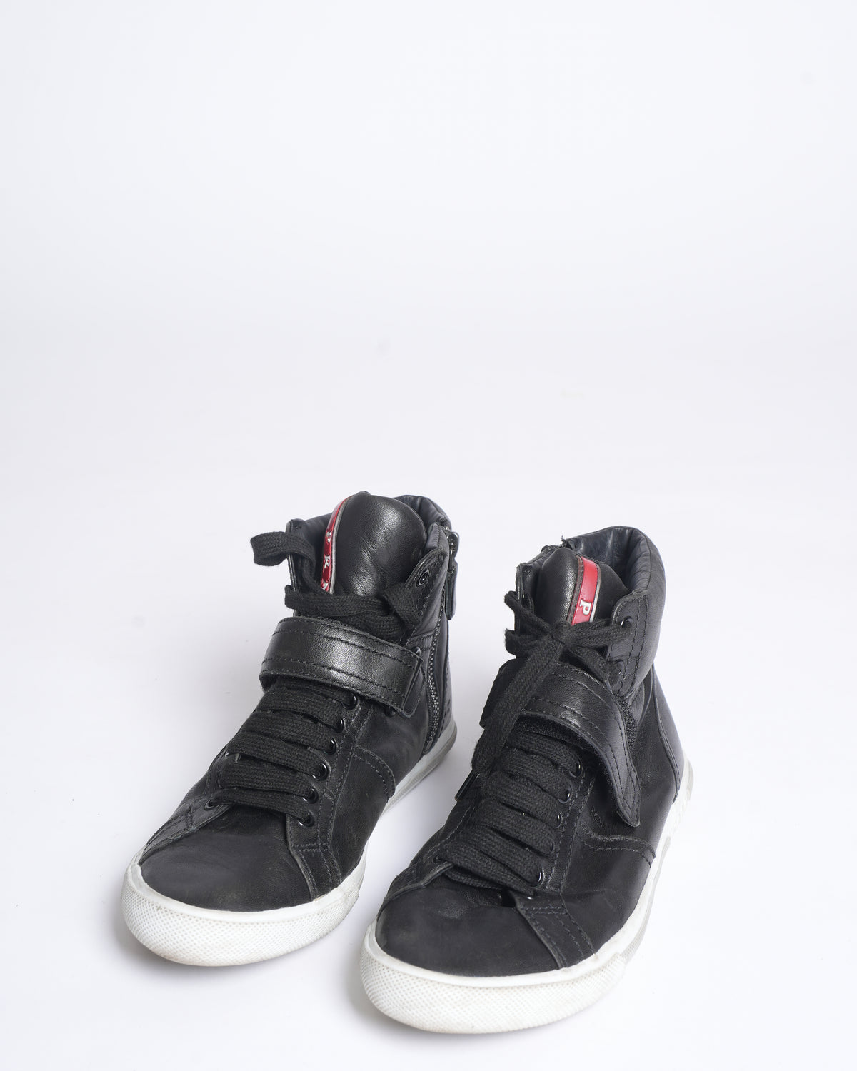 Prada high top black leather sneakers