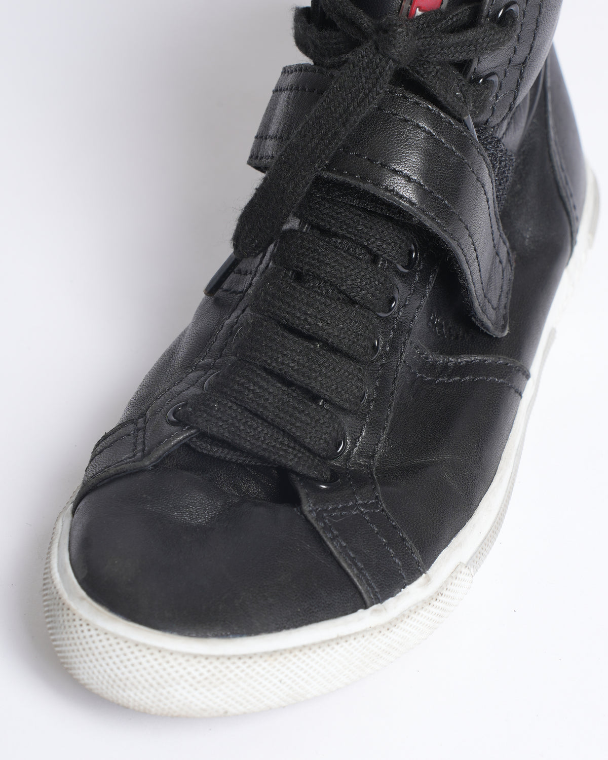 Prada high top black leather sneakers
