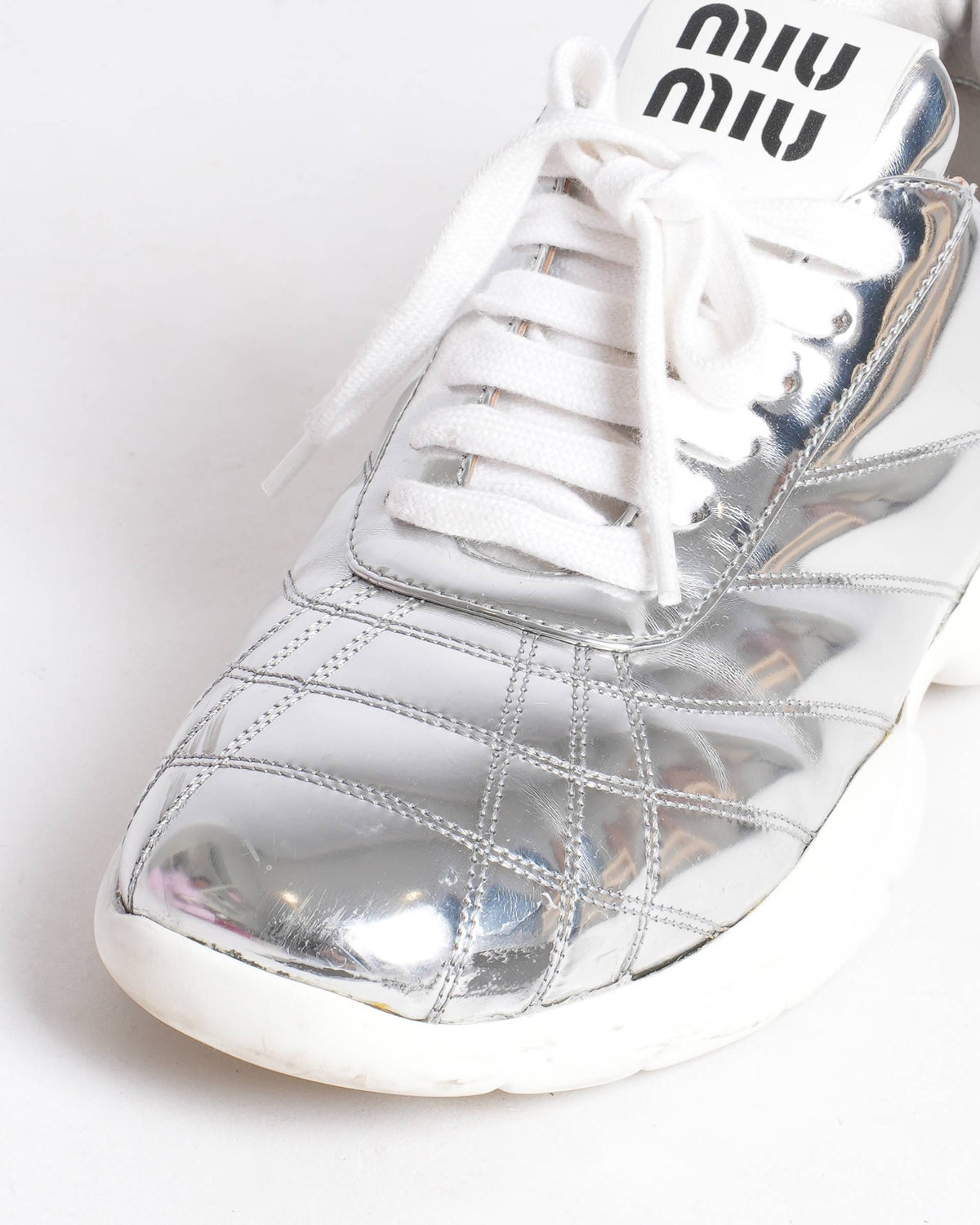 Miu Miu silver quilted metallic leather sneakers
