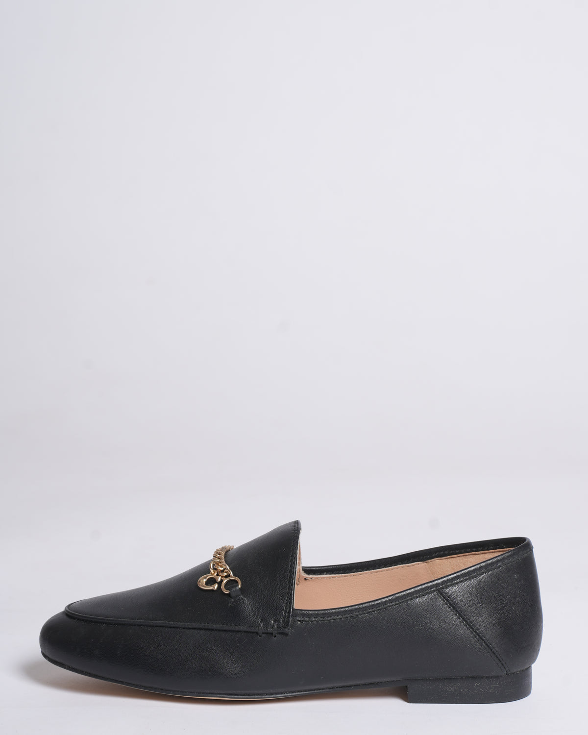 New Coach Hanna loafers in black with a gold-tone chain