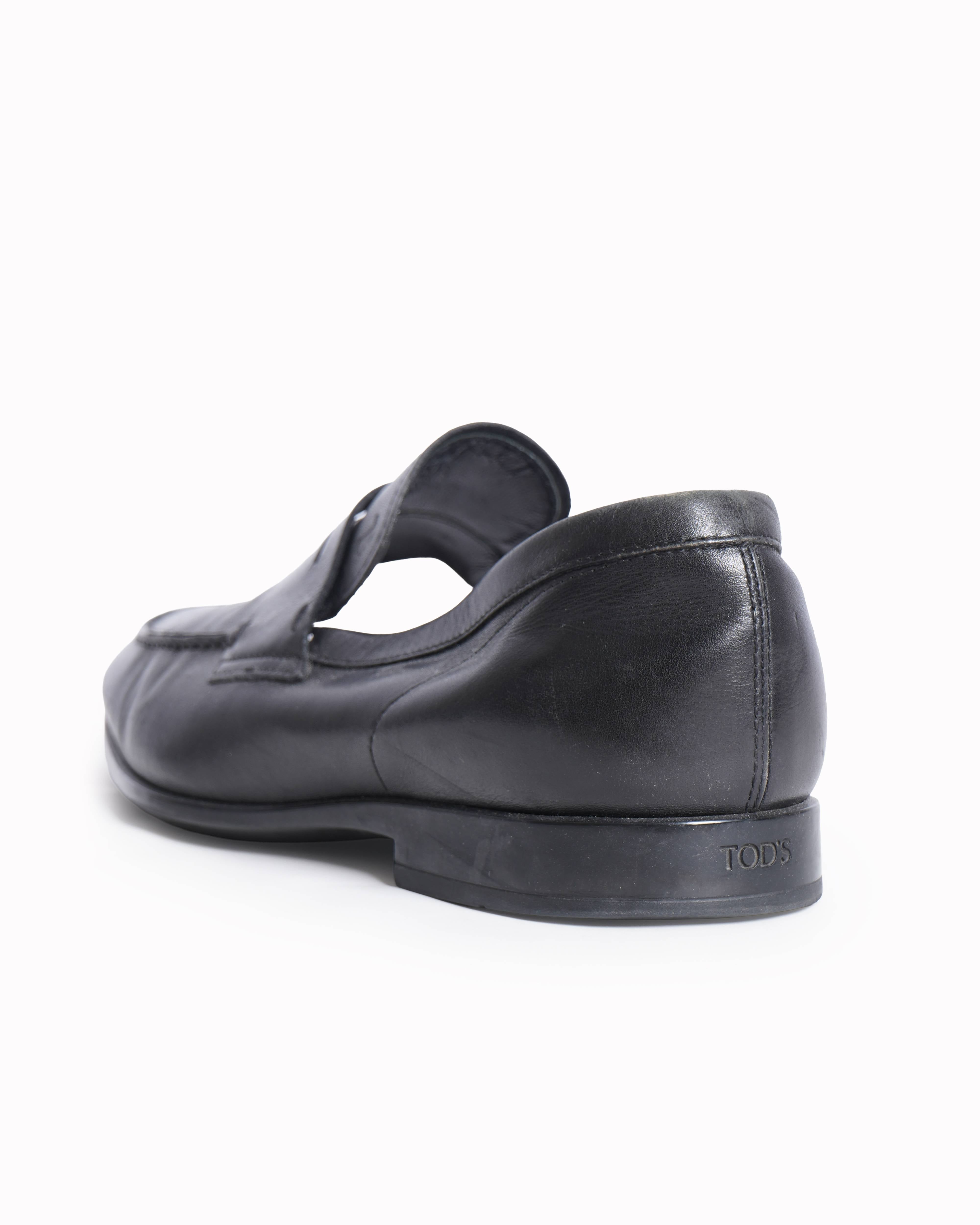 Tod’s black leather gomma leggera moccasins