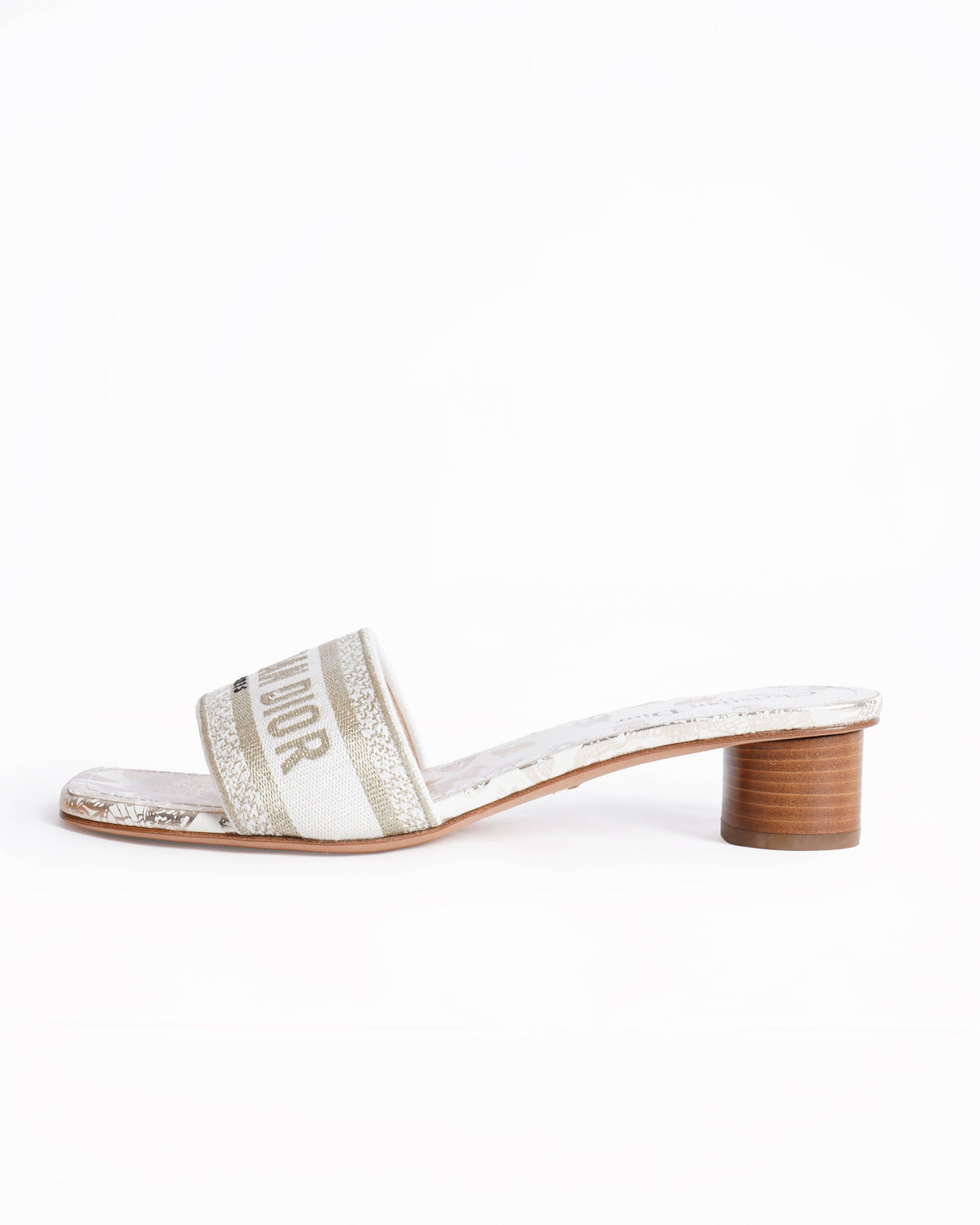 Christian Dior 
Dway cloth mules