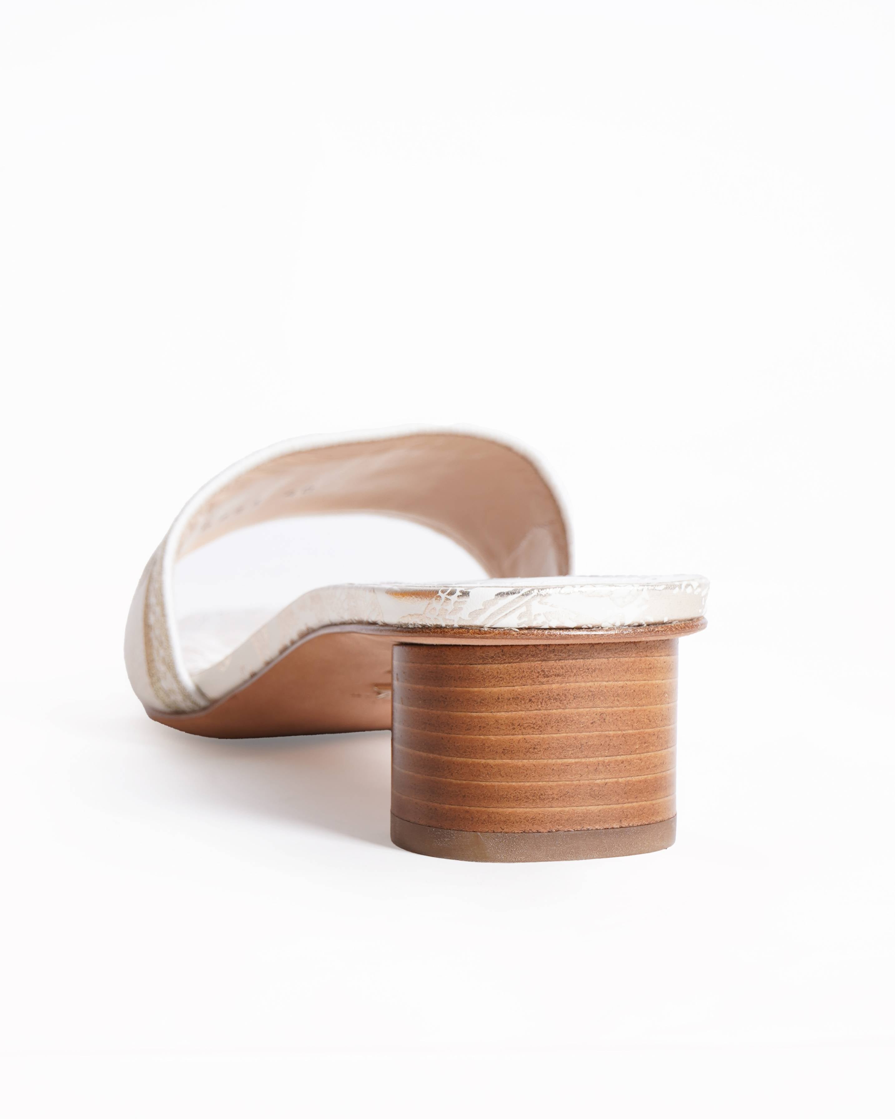 Christian Dior 
Dway cloth mules