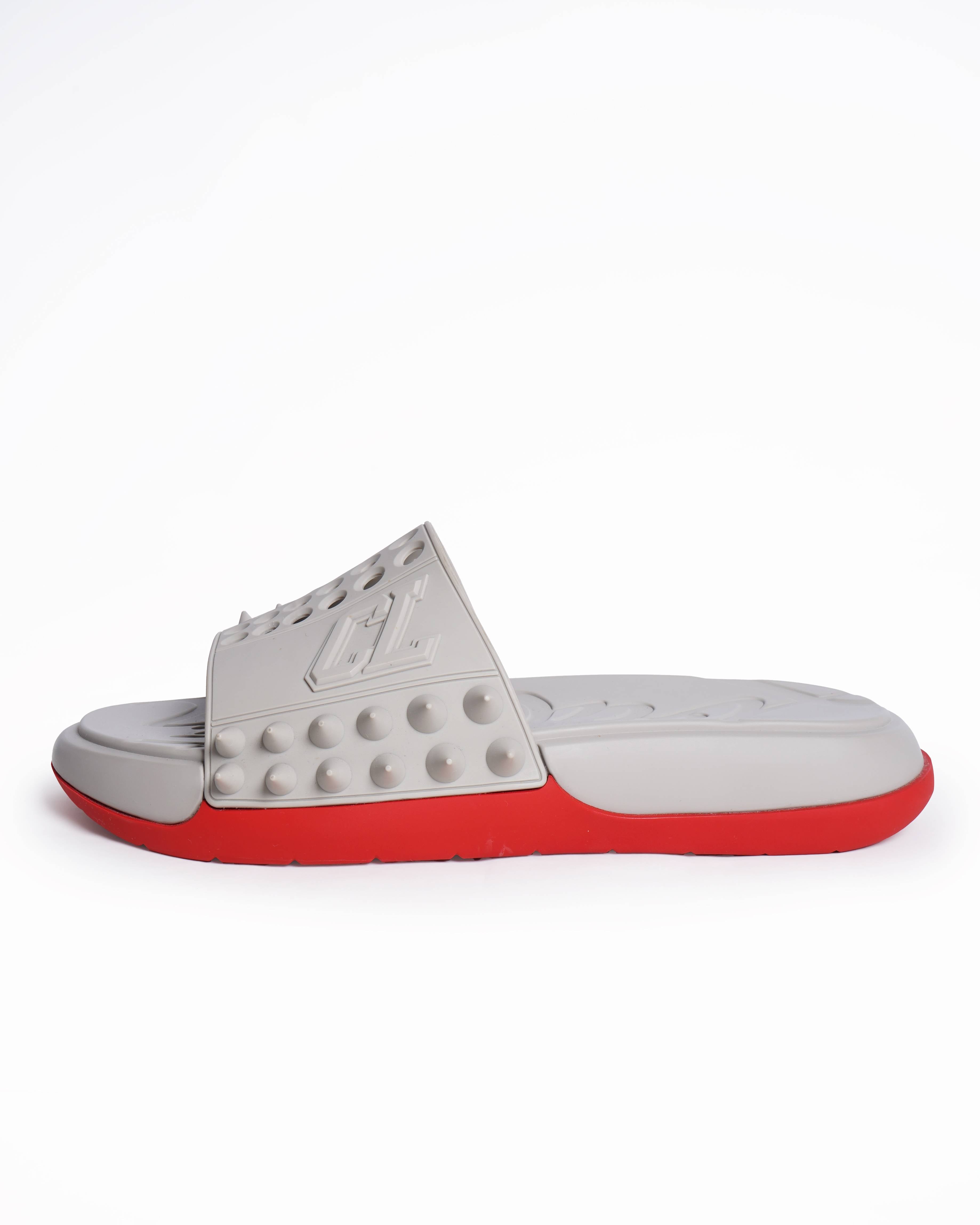New Christian Louboutin
Take It Easy perforated spiked slides