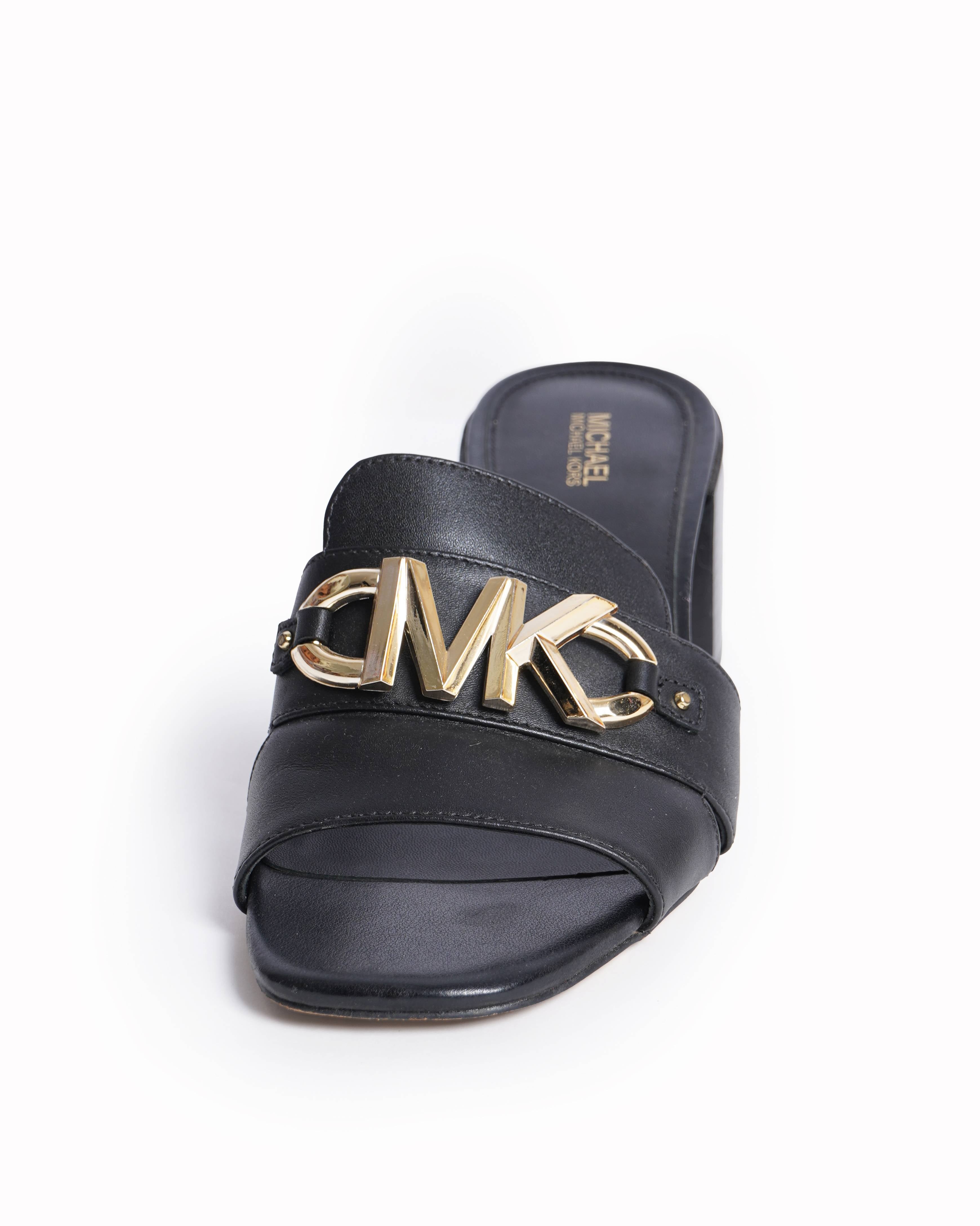 Michael Kors 
zzy Logo Mules in Leather