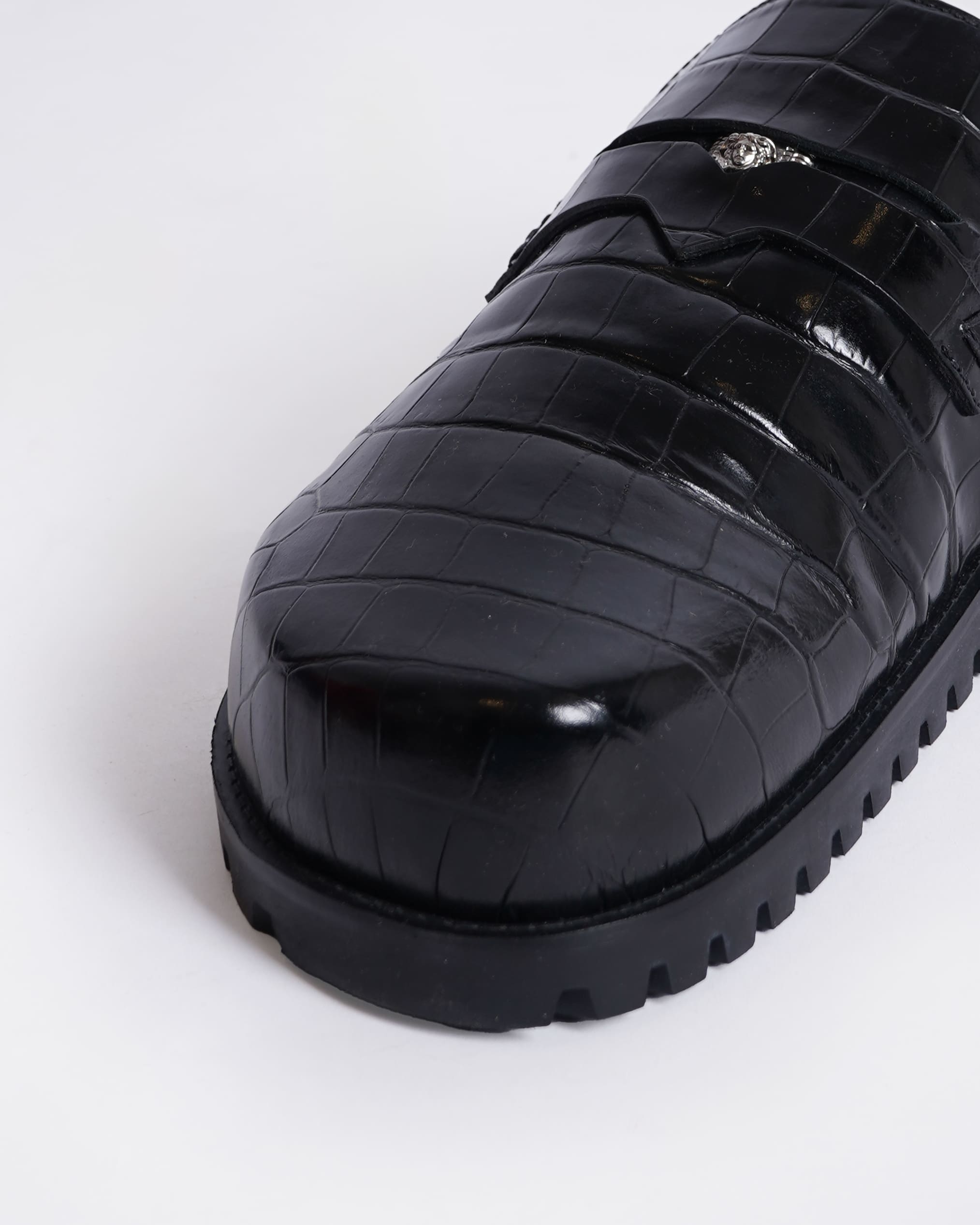 New Versace
Medusa crocodile-embossed slides