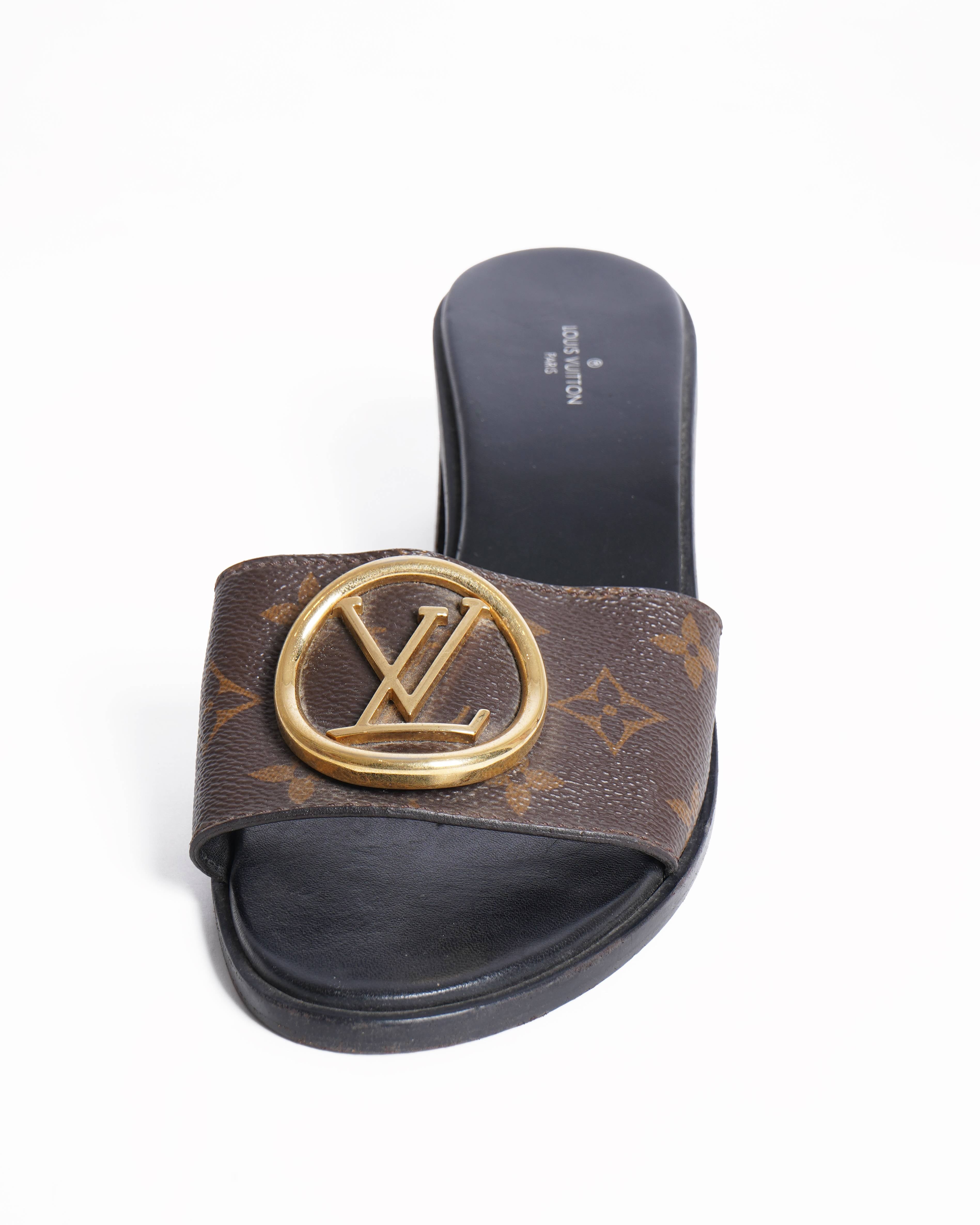 Louis Vuitton 
Lock it leather mules