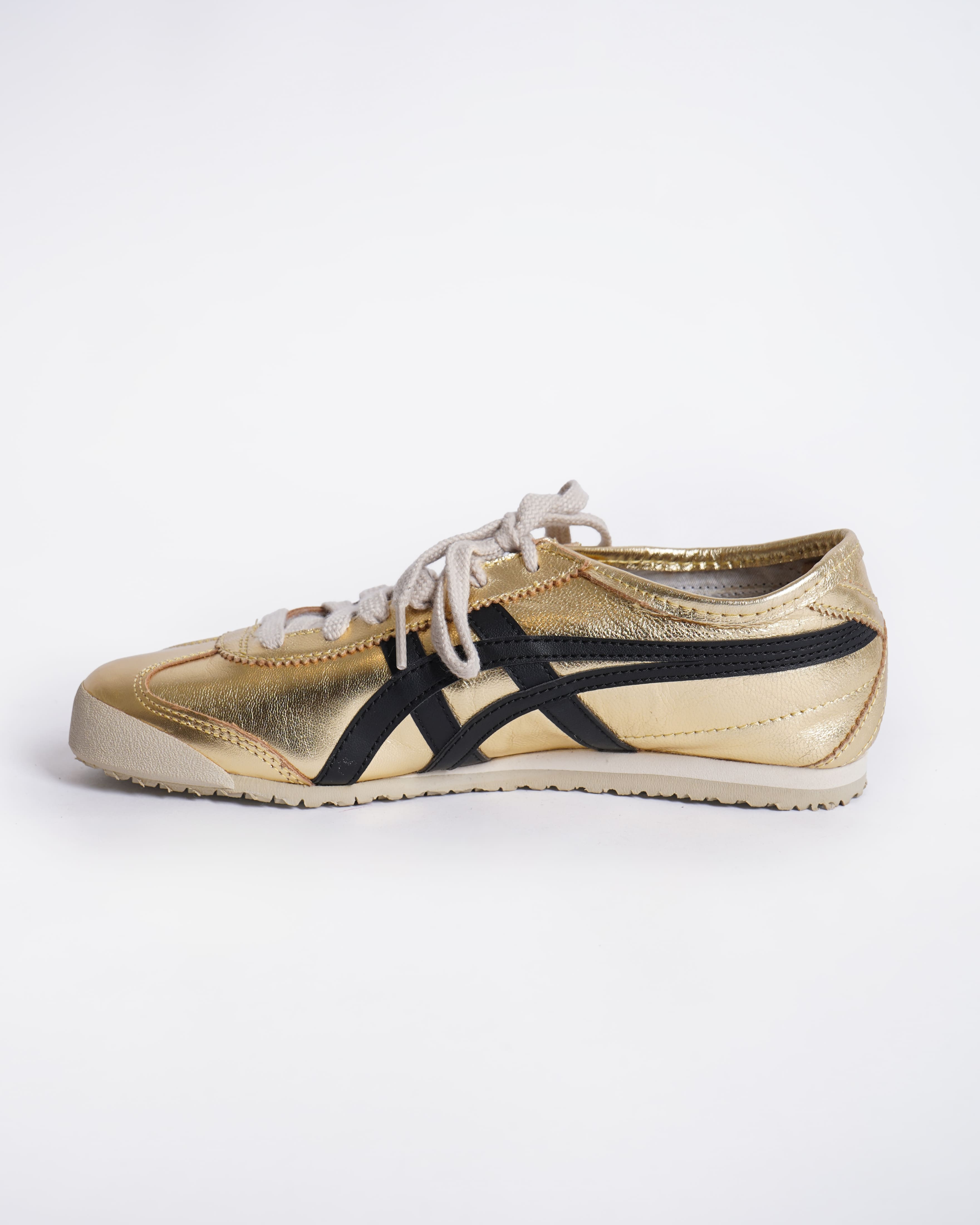 Onitsuka gold and black sneakers