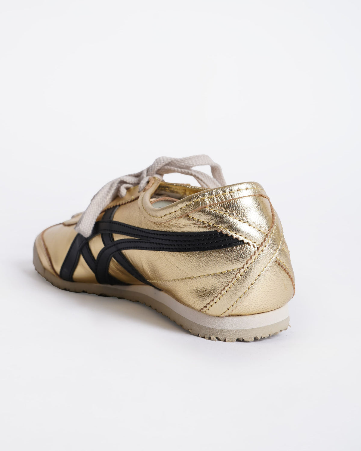 Onitsuka gold and black sneakers