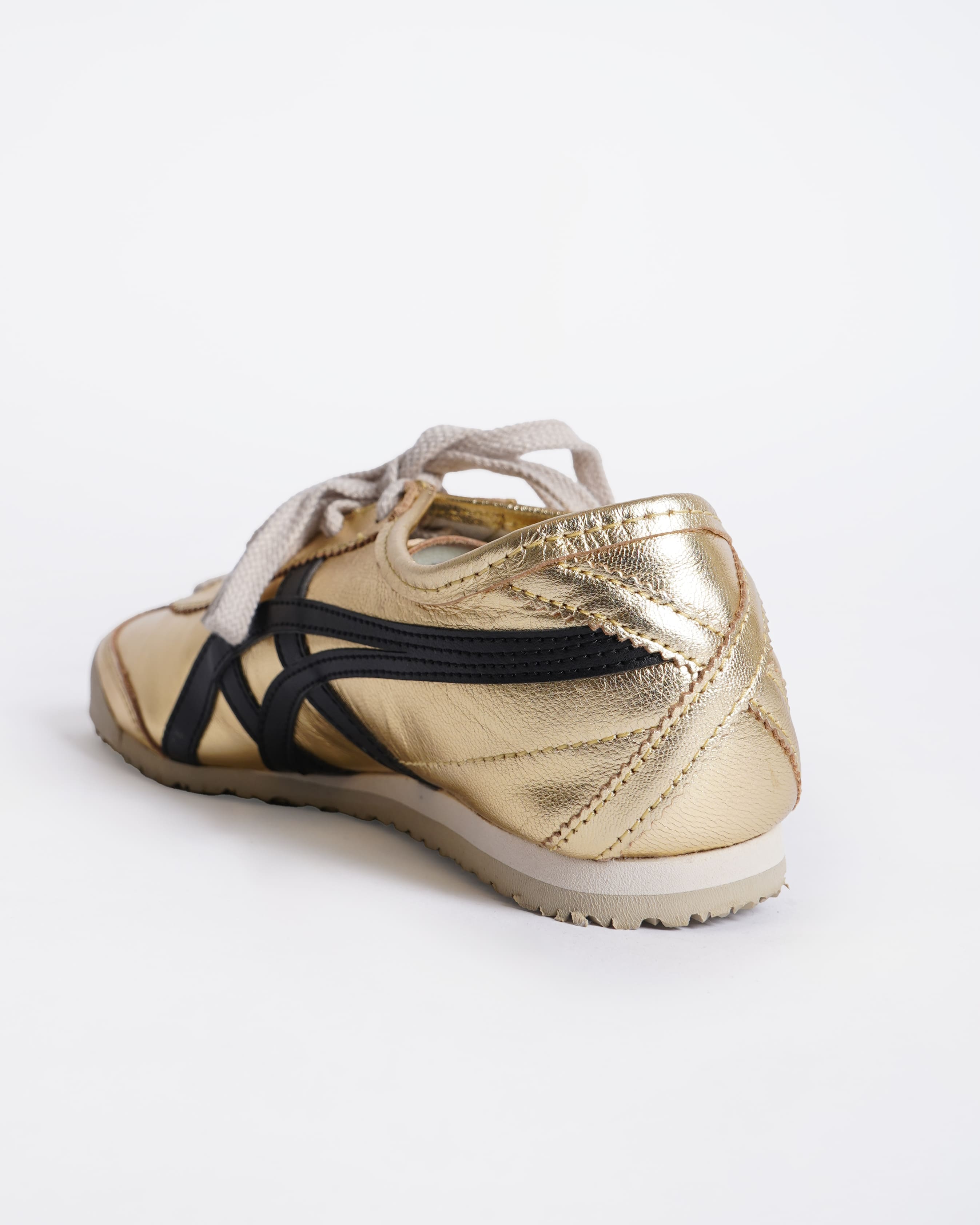 Onitsuka gold and black sneakers
