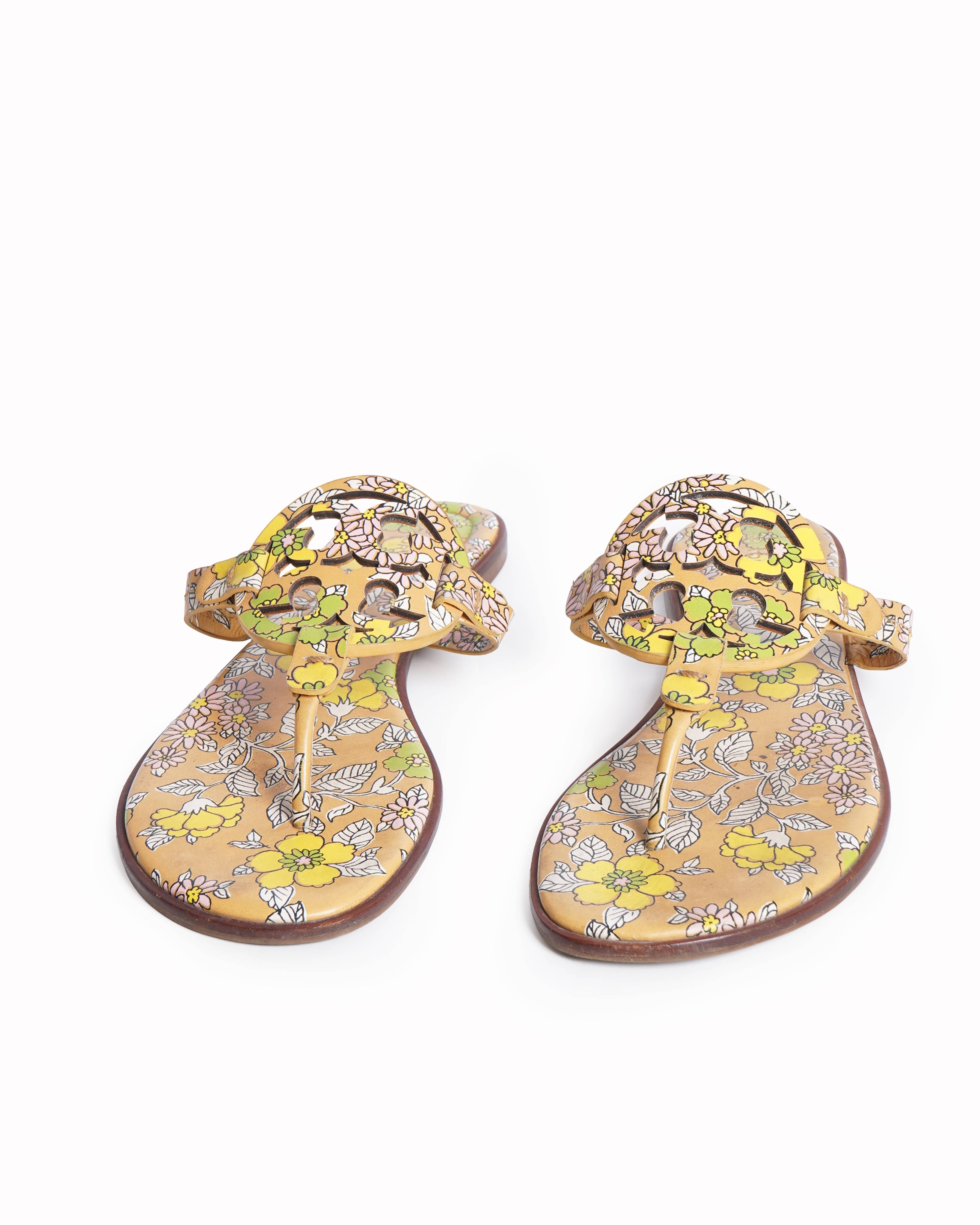 Tory burch 
Beige printed leather flat sandals