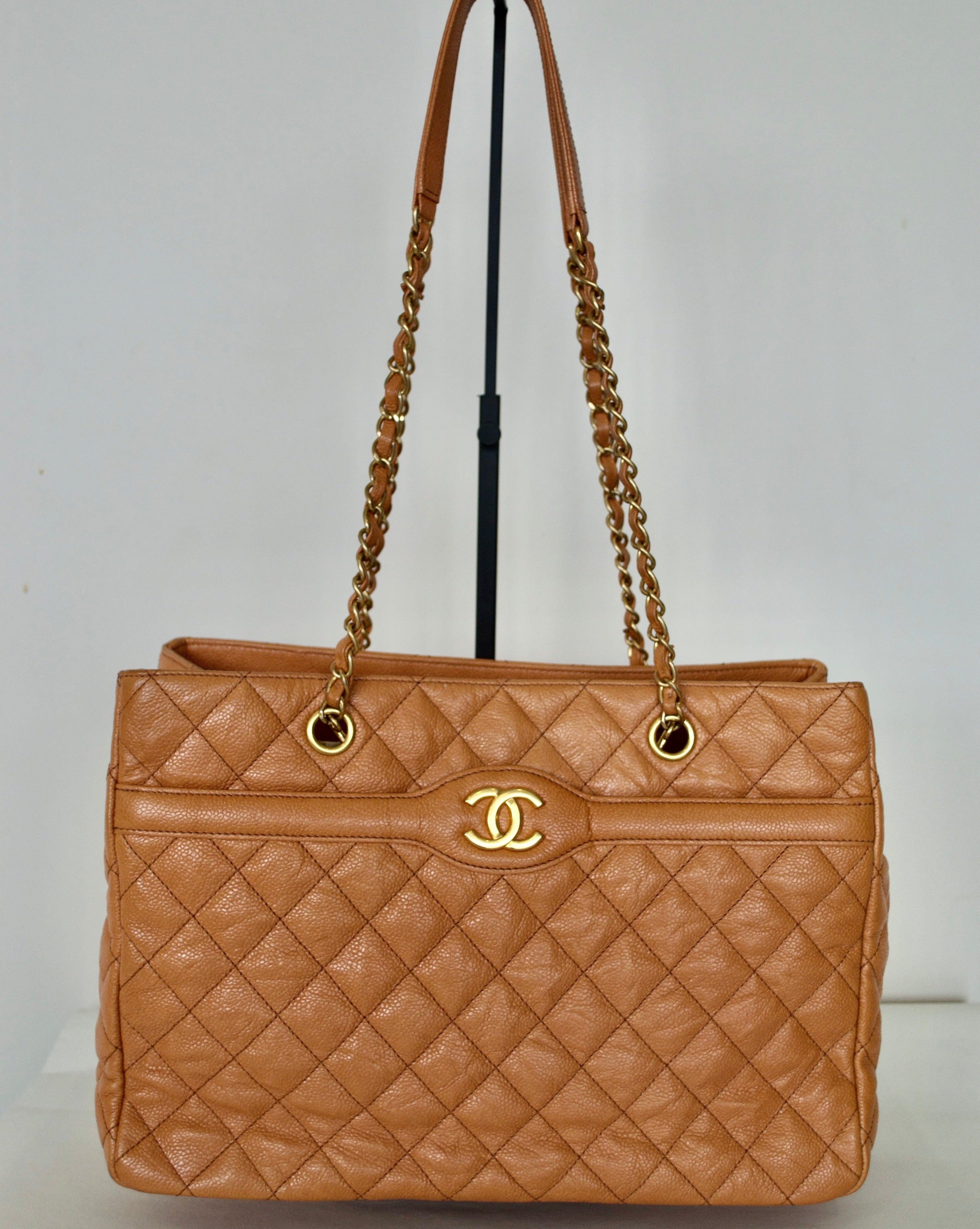 Sold at Auction A LARGE CHANEL PADDED TANBROWN HAND BAG with chrome  double C 33cm long 24cm high with long chrome and l